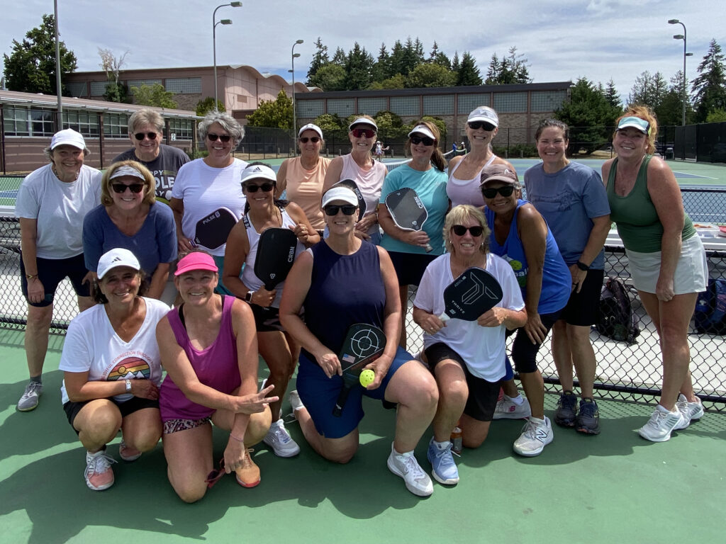 group of pickleball players at courts